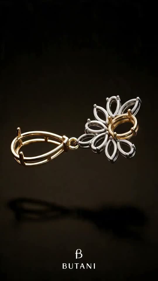 Gold and white-gold pendant settings floating on black