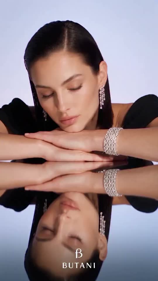 Model resting on a mirror wearing Butani diamonds