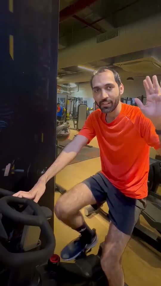 Trainer on an exercise bike in a gym